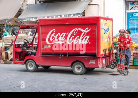 Merida Mexico,centro historico central historic district,Calle 56,Coca-Cola delivery van truck,worker driver using dolly,man men male,adult adults,res Stock Photo