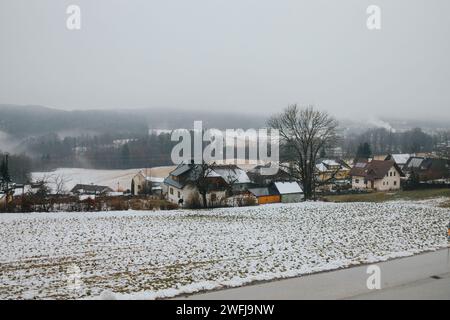 A winter landscape showing a snowy village Stock Photo