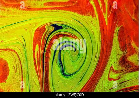 Abstract design featuring vibrant yellow, orange, and black hues against a striking red backdrop Stock Photo