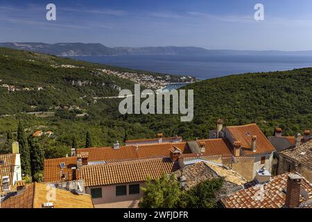 View from the historic town of Labin in Istria to the Croatian seaside resort of Rabac during the day in summer Stock Photo