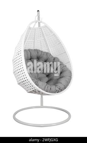 Rattan wicker garden swing chair with a pillow isolated on white. Stock Photo