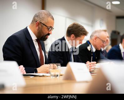 Home Secretary James Cleverly (left), Policing Minister Chris Philp (centre) and Metropolitan Police Commissioner Sir Mark Rowley (third left), attend the National Policing Board meeting at the Home Office in London. Picture date: Wednesday January 31, 2024. Stock Photo