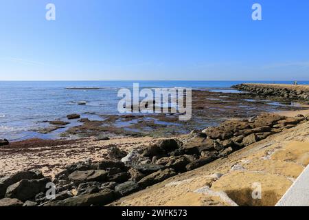 Playa de la Costilla beach and promenade in Rota city, Cadiz, on a sunny day Stock Photo