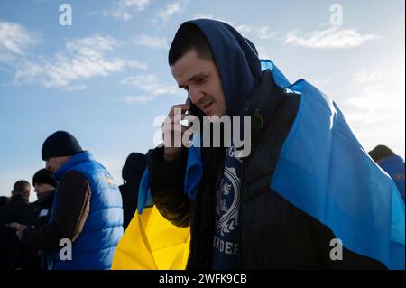 Bakhmut, Ukraine. 31st Jan, 2024. A Ukrainian soldier calls his family after arriving back home following a POW exchange between Russia and Ukraine, January 31, 2024 in an undisclosed location. The exchange was the 50th return of prisoners of war and involved 207 Ukrainian defenders. Credit: Pool Photo/Ukrainian Presidential Press Office/Alamy Live News Stock Photo