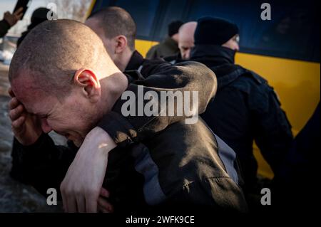 Bakhmut, Ukraine. 31st Jan, 2024. Ukrainian soldiers overwhelmed by emotion after arriving back home following a POW exchange between Russia and Ukraine, January 31, 2024 in an undisclosed location. The exchange was the 50th return of prisoners of war and involved 207 Ukrainian defenders. Credit: Pool Photo/Ukrainian Presidential Press Office/Alamy Live News Stock Photo