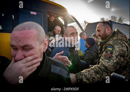 Bakhmut, Ukraine. 31st Jan, 2024. Ukrainian soldiers overwhelmed by emotion after arriving back home following a POW exchange between Russia and Ukraine, January 31, 2024 in an undisclosed location. The exchange was the 50th return of prisoners of war and involved 207 Ukrainian defenders. Credit: Pool Photo/Ukrainian Presidential Press Office/Alamy Live News Stock Photo