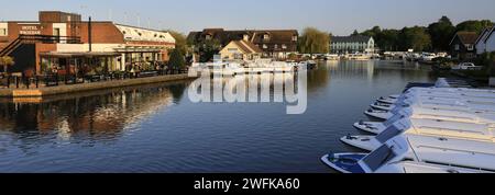 Pleasure boats on the River Bure at Wroxham town in the Norfolk Broads, Norfolk, England, UK Stock Photo