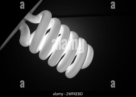 White spiral photography lamp. Black background. Stock Photo