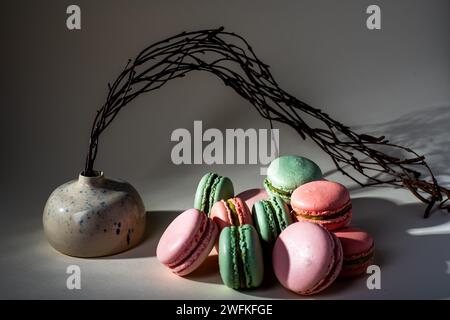 Close up colorful macarons dessert on white background. Stock Photo