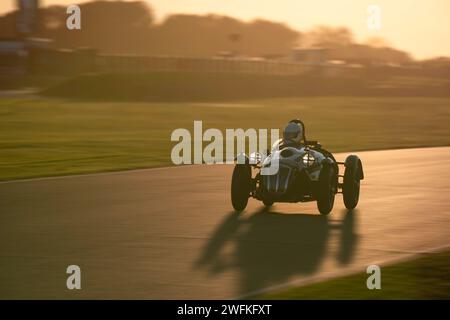 A Frazer Nash Le Mans Replica racing round Goodwood Motor Circuit during the Freddie March Memorial Trophy evening race. Stock Photo