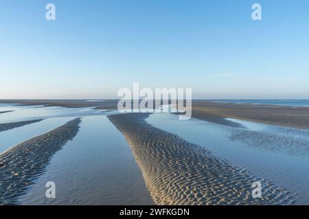 Sculptured sands are revealed at low tide on the unspoilt West Wittering beach. Stock Photo