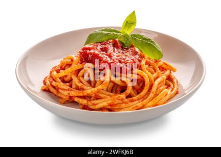 Bucatini pasta with tomato sauce and basil leaves in white plate isolated  with clipping Path included Stock Photo