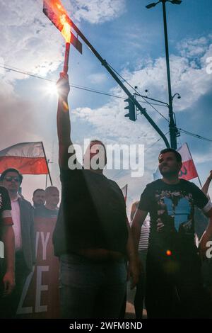 People light flares as they protest against the arrest of Istanbul's ...