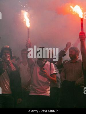 People light flares as they protest against the arrest of Istanbul's ...