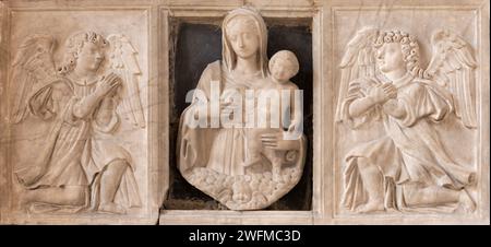 NAPLES, ITALY - APRIL 21, 2023: The marble relief of renaissance Madonna among the angels in the church Chiesa di Sant'Anna dei Lombardi Stock Photo
