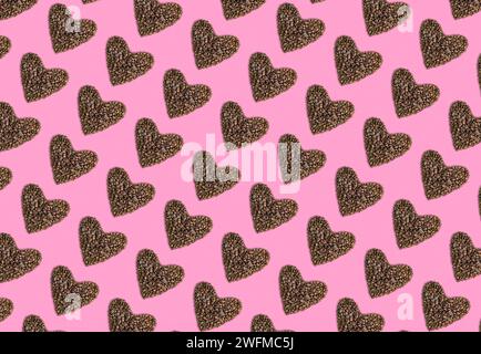 Pattern of hearts made from coffee beans on pink background. Valentines day concept. Stock Photo