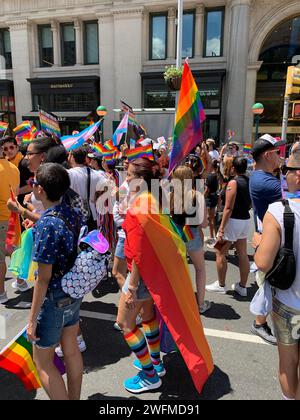 Participants in the World Pride parade in New York City happy march through the streets in celebration of the LBGT community Stock Photo
