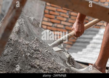 Asian construction workers doing their works in the morning. Building residential houses. Stock Photo