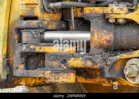 Close up photograph of an old and dirty part of heavy equipment. Machinery background. Stock Photo