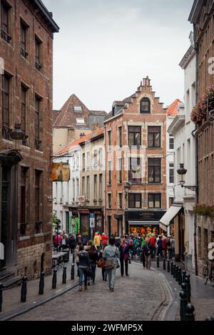 Rue du Chêne street in central Brussels. Popular pedestrian street in Brussels old town near Manneken Pis landmark. Narrow cobbled street. Stock Photo