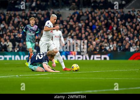 Richarlison of Tottenham Hotspur takes the ball off Nathan Collins of Brentford FC during the Premier League match between Tottenham Hotspur and Brentford at Tottenham Hotspur Stadium, London, England on 31 January 2024. Photo by Phil Hutchinson. Editorial use only, license required for commercial use. No use in betting, games or a single club/league/player publications. Credit: UK Sports Pics Ltd/Alamy Live News Stock Photo