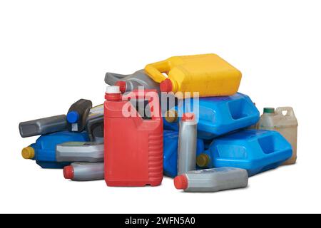 pile of old used plastic oil cans, motor or engine oil chemical gallon for recycle, various sizes and colors of empty waste containers or canisters Stock Photo