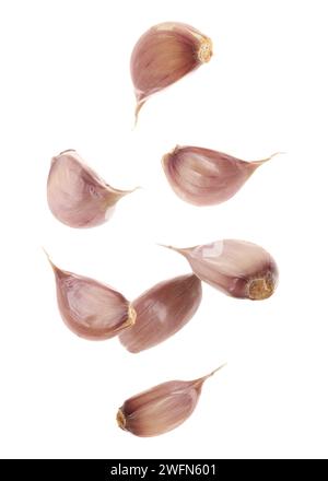 Fresh garlic cloves falling on pale green background Stock Photo - Alamy