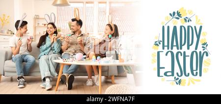 Greeting banner with happy family painting eggs for Easter celebration Stock Photo