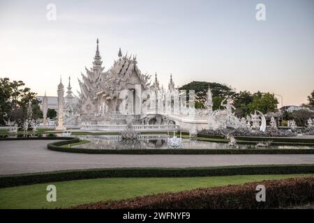 A general view of the White Temple during late afternoon as the sun sets. The 'Wat Rong Khun' most commonly known as the 'White Temple' was designed and constructed by famous Thai artist Chalermchai Kositpipat and opened to visitors in 1997. The Temple attracts a large number of visitors daily, both locals and tourists which makes it the number 1 attraction in Chiang Rai, Northern Thailand. (Photo by Guillaume Payen / SOPA Images/Sipa USA) Stock Photo