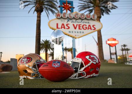 San Francisco 49ers, Kansas Chiefs helmets and the Vince Lombardi trophy at the Welcome to Fabulous Las Vegas sign, Tuesday, Jan. 30, 2024, in Las Veg Stock Photo