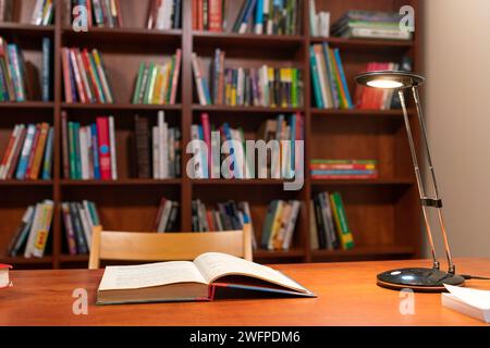 Open book on the table in library Stock Photo