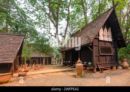 Chiang Rai,Thailand-March 31 2023:Within extensive,exquisite grounds,a collection of dark and black wood buildings,and artefacts,featuring works by Th Stock Photo