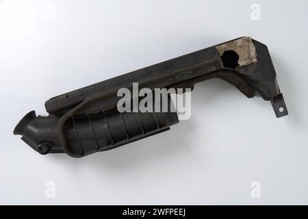 a broken air filter pipe from a car engine that needs to be replaced Stock Photo
