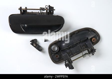 front and back views of the exterior car door handle which is damaged and needs to be replaced Stock Photo