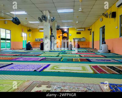 Lumut,Perak-January 12 2024: It looks like some people are chanting and praying while waiting for the time to perform the obligatory Friday prayer in Stock Photo