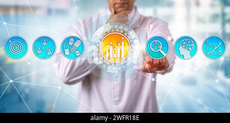 Pensive, yet unrecognizable male scientist is identifying key usage patterns. Concept for predictive analytics, machine learning, artificial intellige Stock Photo