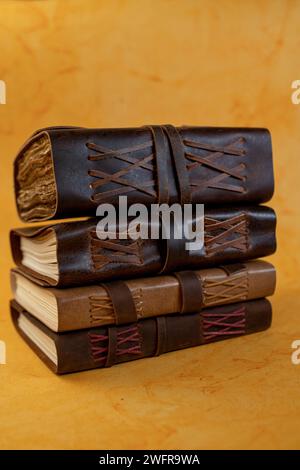 Book stack on plain yellow background Stock Photo