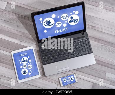 Trust concept shown on different information technology devices Stock Photo