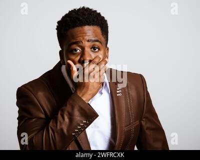 Portrait of young businessman who is shocked. Stock Photo