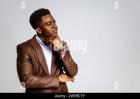 Portrait of young businessman who is thoughtful and worried. Stock Photo