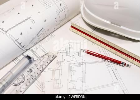 Background of architecture plans, hard hat and architect tools on table. Housing development Stock Photo