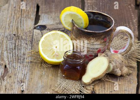 Ginger tea with lemon an honey on a wooden table Stock Photo