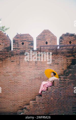 South Asian girl and Tha Phae gate at Old city in Chiang Mai Thailand Stock Photo