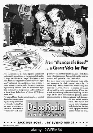 “FROM ‘MUSIC ON THE ROAD’ TO ‘A CLEARER VOICE FOR WAR’…DELCO RADIO OF GENERAL MOTORS”  “An American World War II advertisement for Delco Radio from General Motors. The black and white image, styled like a newspaper clipping, features a man in a military uniform working on a radio. The graphic style of the advertisement is typical of the 1940s, with its bold typography and detailed illustrations. The advertisement promotes the use of Delco Radio in military vehicles during World War II and encourages support for the troops with the phrase ‘Back our boys…by buying bonds’.” - American (U.S.) adve Stock Photo