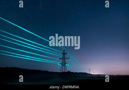 Electricity transmission towers with glowing wires against the starry sky. Energy concept. Stock Photo