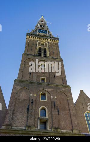 The tower of the Old Church (Oude Kerk), the oldest building in Amsterdam, North Holland, Netherlands. Stock Photo