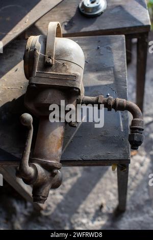 old machine part displayed in mechanic workshop Stock Photo