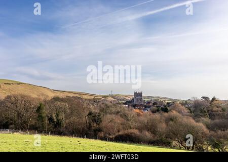 Distant view of the chruch at Corfe Castle in Dorset, England on a winter morning. Stock Photo