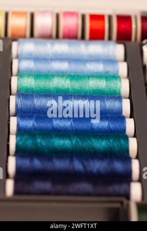 colorful sewing threads on spools Stock Photo