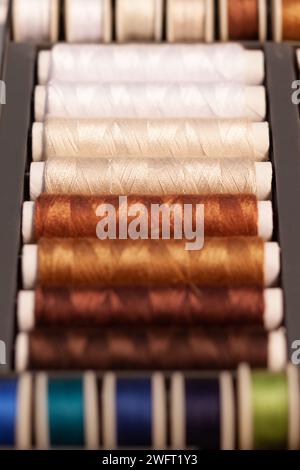 colorful sewing threads on spools Stock Photo